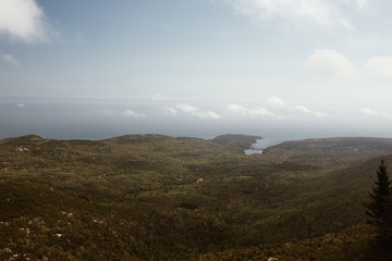 View of Maine coastline in the distance from Cadillac Mountain on Mount Desert Island in Acadia National Park