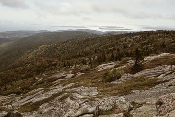 View of Maine coastline in the distance from Cadillac Mountain on Mount Desert Island in Acadia National Park
