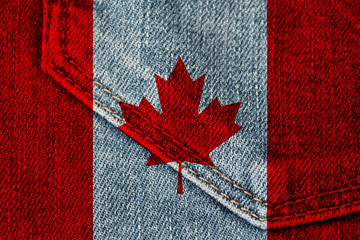 photo of the beautiful colored national flag of the modern state of Canada on textured fabric, concept of tourism, emigration, economics and politics, closeup