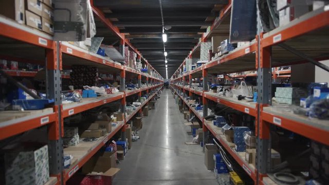 New York, USA - March, 5, 2019: Close up shelf at the factory industrial industry logistic package transportation warehouse shelving storehouse vehicle crate delivering driver machine slow motion