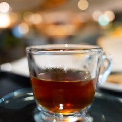 cup of coffee in glass on table