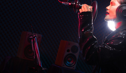 Asian Teenager Woman black hair earmuff headphone sing a song loudly power sound over hanging...