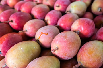 red stacks of mango fruits
