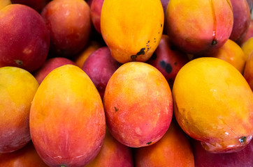 red stacks of mango fruits