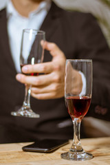 glass of red wine in hand