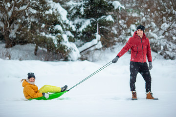 Family of dad and kids vacation on Christmas eve outdoors