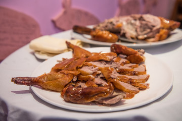 Cooked Beijing roast duck served on a plate in a restaurant