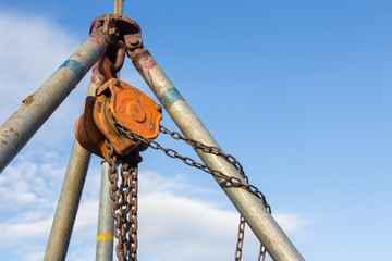 Chain hoist used in construction  on blue sky background