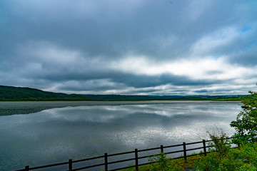 Lake Takkobu in summer cloudy day. It is the smallest freshwater lake in the south of Kushiro Wetland San Lake. Hokkaido, Japan