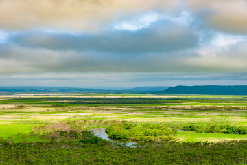 Fototapeta na wymiar Kushiro Shitsugen national park in Hokkaido in summer day, view from Hosooka observation deck, the largest wetland in Japan. The park is known for its wetlands ecosystems