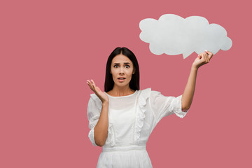 shocked girl holding thought bubble isolated in pink