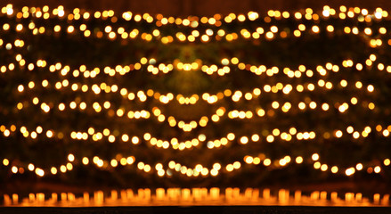 Bokeh blurred yellow and gold color background.