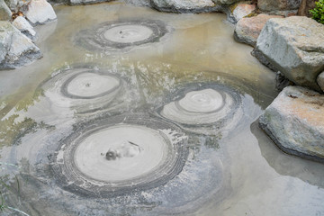Oniishi bozu jigoku hell Beppu , focus to circle bubbles forming in grey  mud Shaven Monk’s Head Hell hot spring at Beppu, Oita-shi, japan.