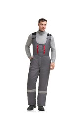 Handsome male in gray work overalls view