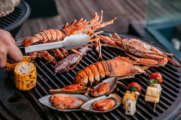 Lobster and mix seafood barbecue cokking on grill - 294756800