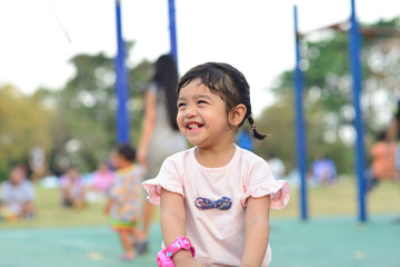 Little Child Girl and Mother Portrait with Playground at Chaloem Golden Jubilee Public Park Bangkok Thailand