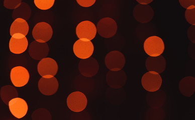 Abstract blurred shiny bokeh lights black background