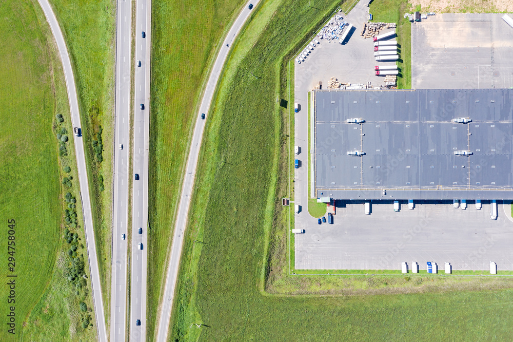 Wall mural aerial top view of trucks loading at logistic center. distribution center from above - Wall murals