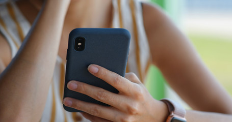Woman use of mobile phone at outdoor