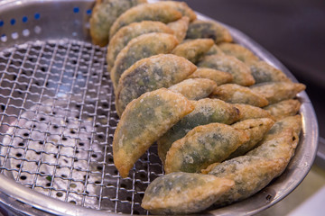 Crispy Fried Chives in a hot pan