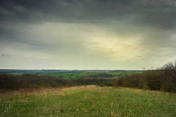 Obraz premium sunset over a green field, steppe, Donbass