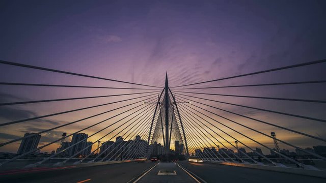 dramatic dusk with traffic flow on bridge putrajaya malysia