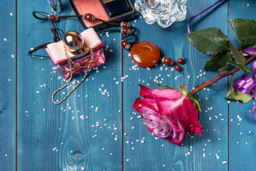 Still life with rose and women's accessories