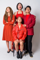 Group of diverse Asian friends thinking and looking up together