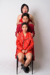 Full body shot of three diverse Asian friends lining up together