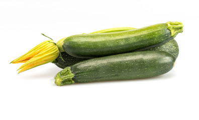 Fresh zucchini squashes on white background