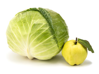 Naklejka premium green cabbage next to quince on a white background