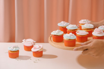 Cupcakes decorated with fondant. Valentine sweet love cupcake on table on light background