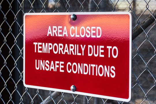 'Area closed temporarily due to unsafe conditions' posted sign