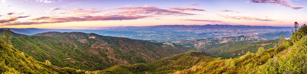 Panoramic view towards San Jose and south San Francisco bay at sunset; Hills and valleys in the...