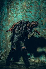 posing as a bloodied zombie