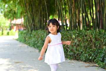 Little Child Girl and Mother Portrait with Playground at Chaloem Golden Jubilee Public Park Bangkok Thailand