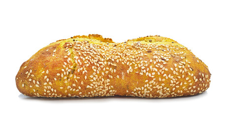 wheat bun with turmeric and sesame seeds on a white background