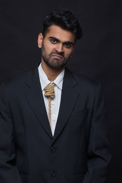 young corporate executive  smiling on the outside and suffering on the inside	