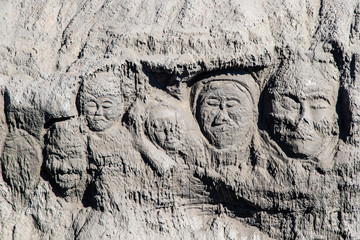 Faces carved in volcanic ash deposited at the foot of Mount Bromo, in East Java, Indonesia. 