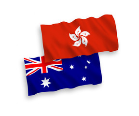 National vector fabric wave flags of Australia and Hong Kong isolated on white background. 1 to 2 proportion.