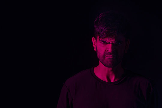 portrait of an angry man in red	