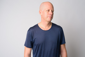 Obraz premium Portrait of mature handsome bald man thinking