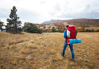 Naklejka na ściany i meble Hiker with a backpack walks high in the mountain. Crimea 