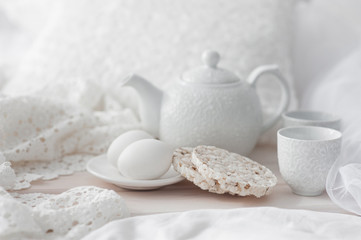 Tray with breakfast on a bed