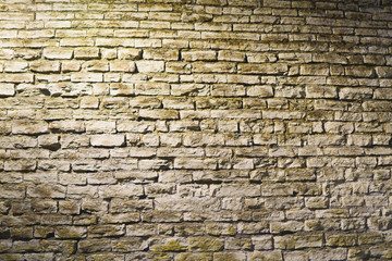 Fototapeta premium Vintage old stone wall texture. night shoot