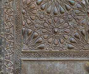 Ornaments of the bronze plate door of ancient historic mosque of Sultan Basque, Cairo, Egypt