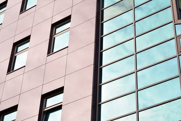 Fototapeta premium The windows of a modern building for offices. Business buildings architecture.