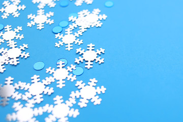 Snowflakes on a blue background. Happy New Year and Christmas background.