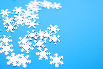 Snowflakes on a blue background. Happy New Year and Christmas background.