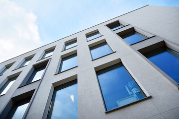 The windows of a modern building for offices. Business buildings architecture.